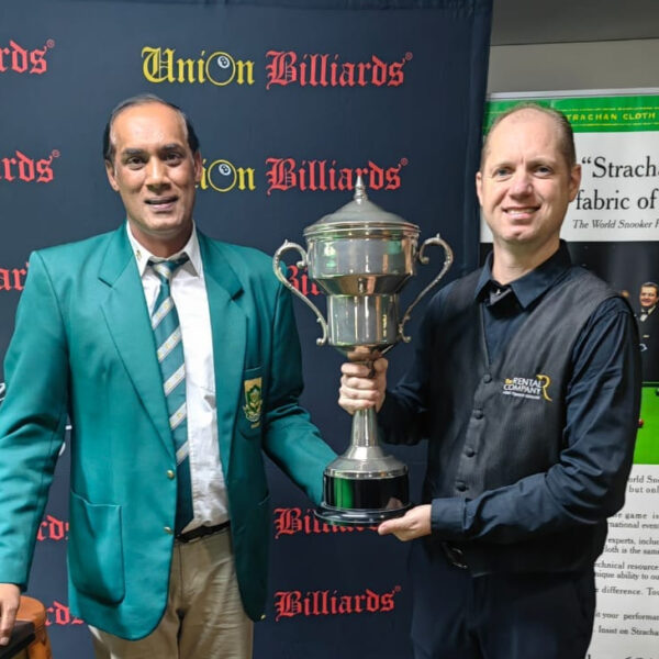 Charl Jonck stands with an official and holds the perpetual SA Snooker Championship trophy.