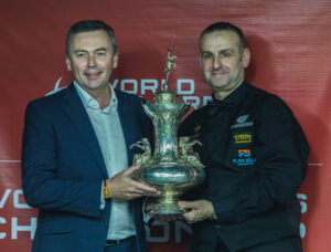 Jason Ferguson and David Causier hold the John Roberts Trophy / World Billiards Championship trophy.