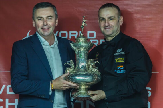 Jason Ferguson and David Causier hold the John Roberts Trophy / World Billiards Championship trophy.
