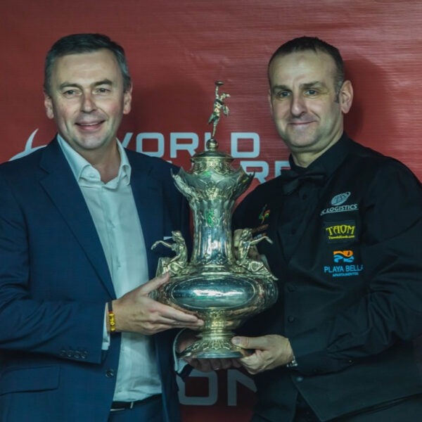 Jason Ferguson and David Causier hold the John Roberts Trophy / World Billiards Championship trophy.