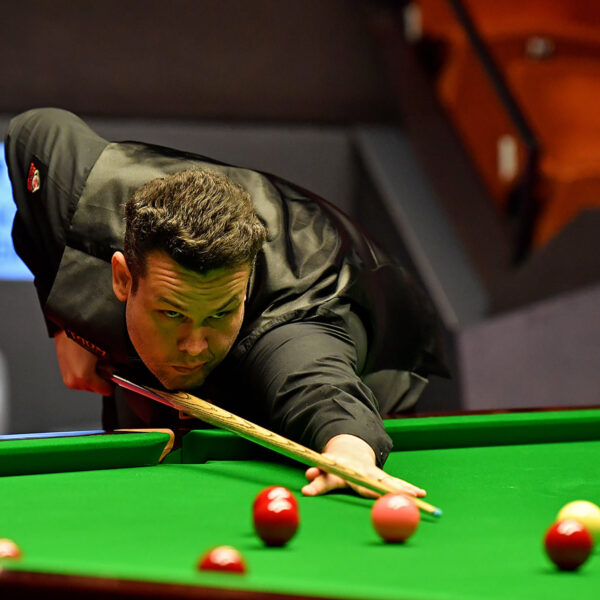Igor Figueiredo plays a shot at the Crucible Theatre during the 2021 World Seniors Snooker Championship.