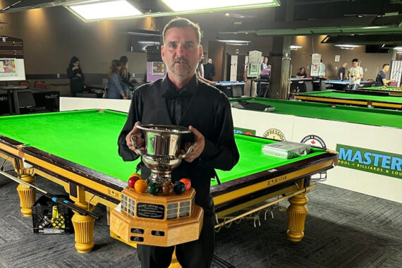 Jason Williams poses with the Canadian Snooker Championship trophy.