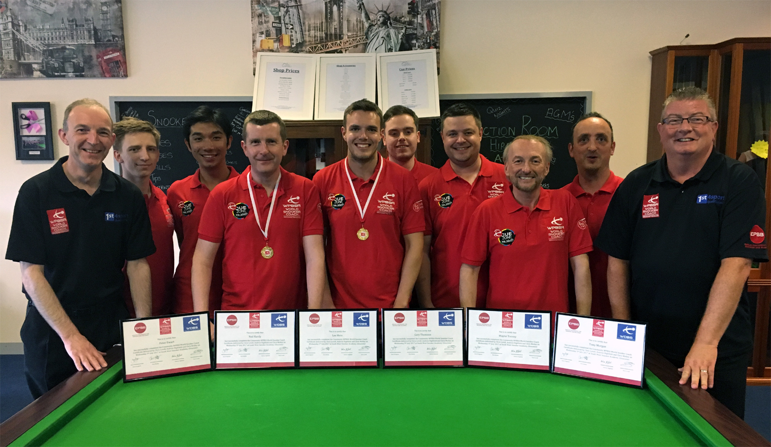 Photo of Chris Lovell with coaches and certificates