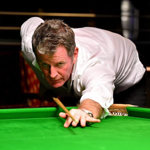 Peter Gilchrist plays a shot.