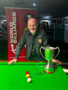 Peter Sheehan poses with the Jim Williamson Open Trophy.