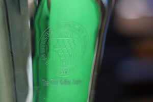 A close up of the engraving on The Tom Kollins Trophy.