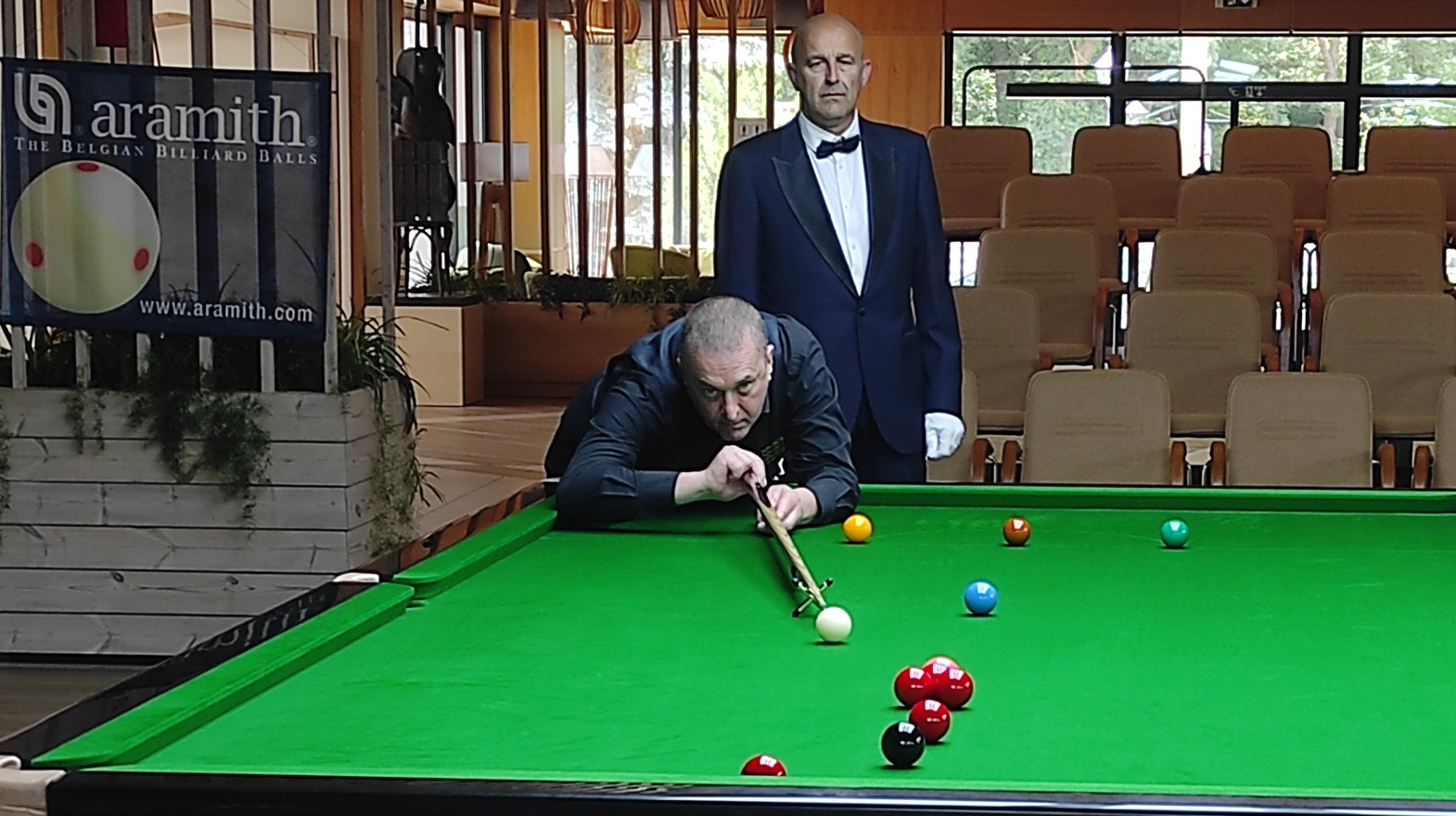 Wayne Brown plays a shot.